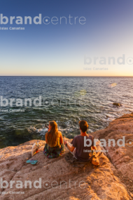 Two young people enjoying the sunset