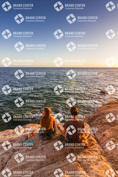 Two young people enjoying the sunset